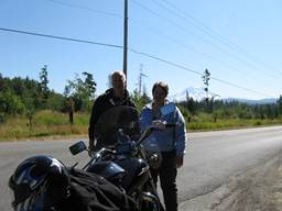 Near Eatonville -- Paul & Lydia near bike with Mt. Rainier behind